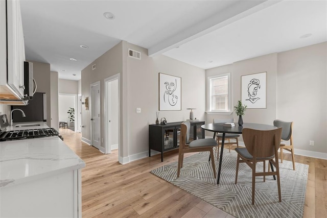 3535 Giles Ave, Saint Louis, MO 63116 - dining room featuring light wood finished floors, baseboards, and recessed lighting
