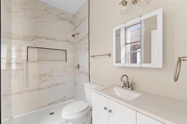 3535 Giles Ave, Saint Louis, MO 63116 - full bathroom featuring vanity, toilet, and a marble finish shower