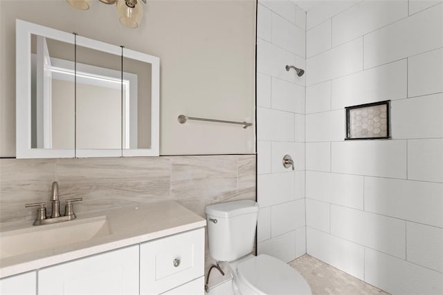 3535 Giles Ave, Saint Louis, MO 63116 - bathroom with tiled shower, toilet, vanity, and tile walls