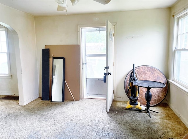 708 E State Route 72, Rolla, MO 65401 - carpeted empty room featuring arched walkways and ceiling fan
