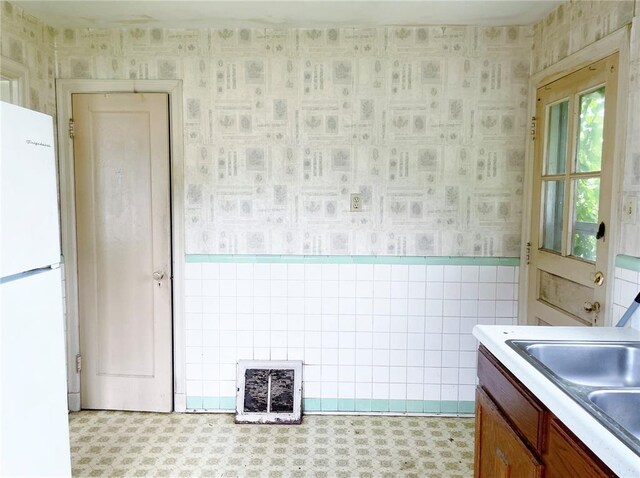 708 E State Route 72, Rolla, MO 65401 - bathroom with wallpapered walls, tile patterned floors, and a sink