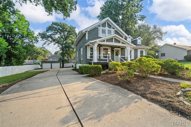317 Greeley Ave, Webster Groves, MO 63119 - view of front facade with covered porch, an outbuilding, and driveway