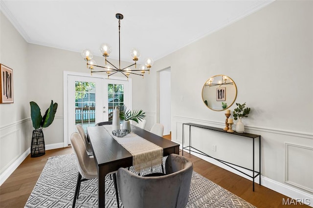 317 Greeley Ave, Webster Groves, MO 63119 - dining room featuring a chandelier, ornamental molding, and wood finished floors