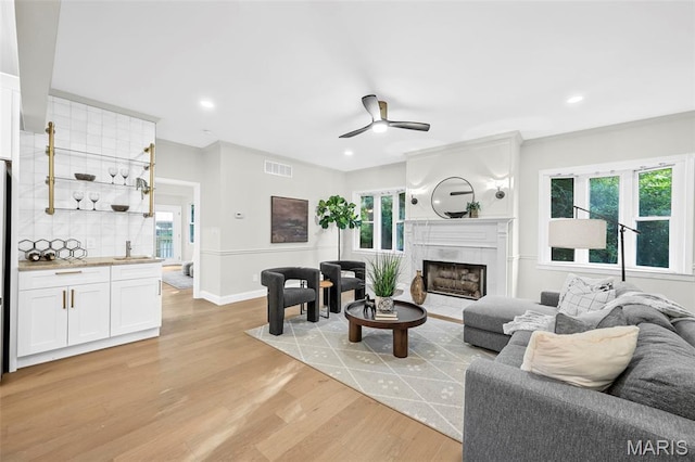 317 Greeley Ave, Webster Groves, MO 63119 - living room with ceiling fan, light wood-style flooring, plenty of natural light, and recessed lighting