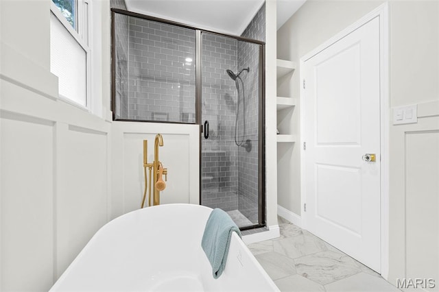 317 Greeley Ave, Webster Groves, MO 63119 - full bath with marble finish floors, a freestanding tub, and a shower stall