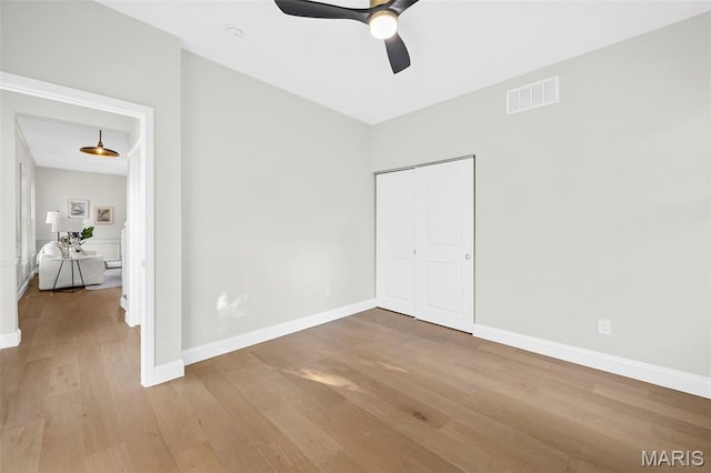 317 Greeley Ave, Webster Groves, MO 63119 - unfurnished bedroom featuring wood finished floors, a closet, and a ceiling fan