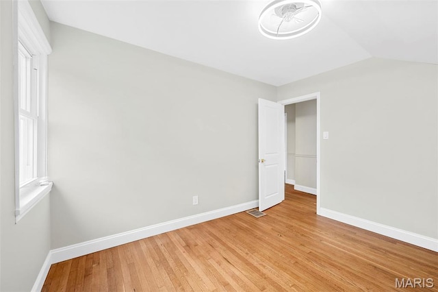 317 Greeley Ave, Webster Groves, MO 63119 - unfurnished bedroom with light wood finished floors and lofted ceiling