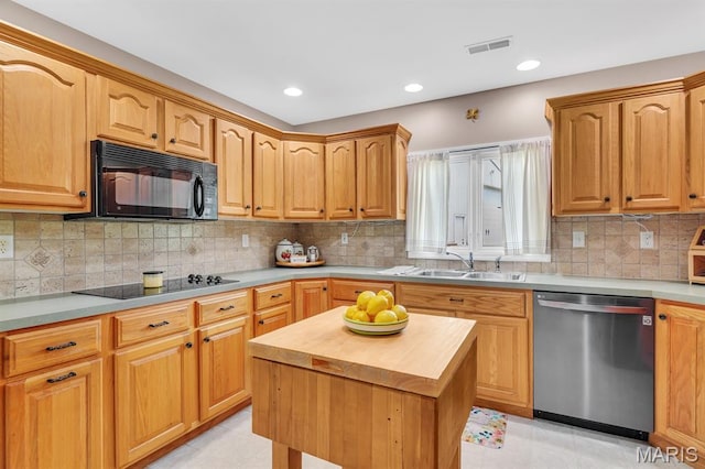 61 Serenity Ln, Troy, MO 63379 - kitchen featuring black appliances, a sink, butcher block counters, tasteful backsplash, and recessed lighting