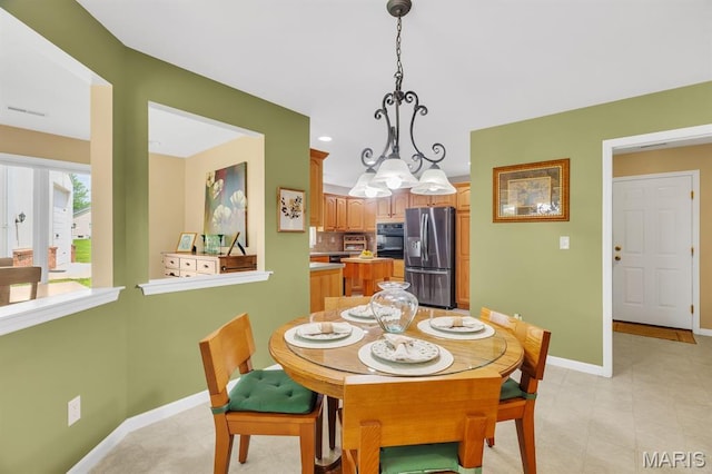 61 Serenity Ln, Troy, MO 63379 - dining area featuring baseboards and a chandelier