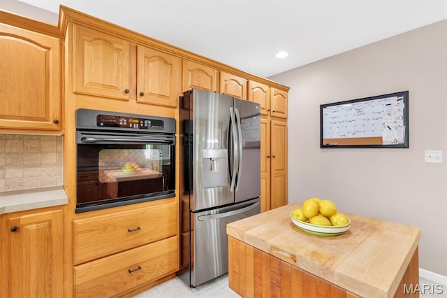 61 Serenity Ln, Troy, MO 63379 - kitchen featuring oven, stainless steel fridge, tasteful backsplash, recessed lighting, and butcher block countertops
