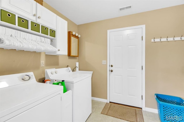 61 Serenity Ln, Troy, MO 63379 - laundry room featuring cabinet space, separate washer and dryer, baseboards, and light tile patterned flooring