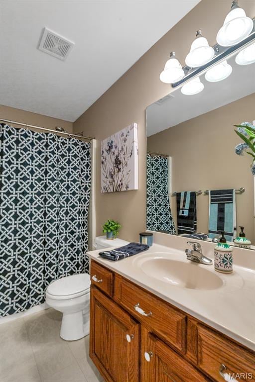 61 Serenity Ln, Troy, MO 63379 - bathroom with toilet, vanity, tile patterned floors, and a shower with curtain
