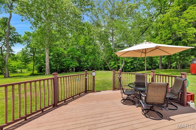 61 Serenity Ln, Troy, MO 63379 - deck featuring outdoor dining area, a lawn, and view of scattered trees