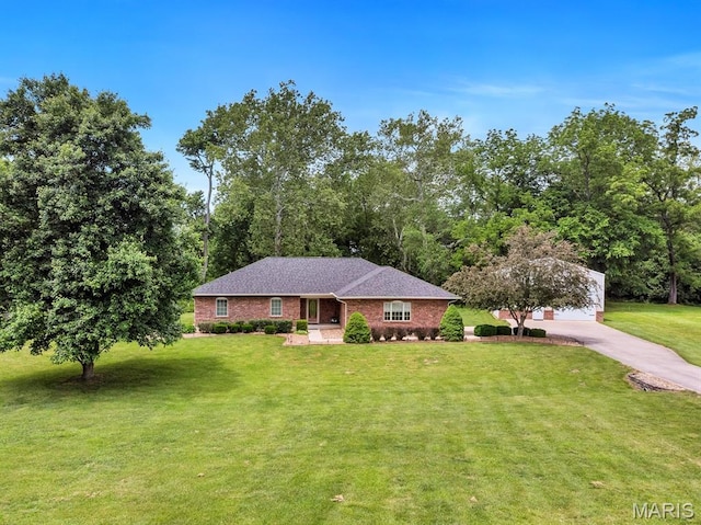 61 Serenity Ln, Troy, MO 63379 - ranch-style home with a front lawn, brick siding, and driveway