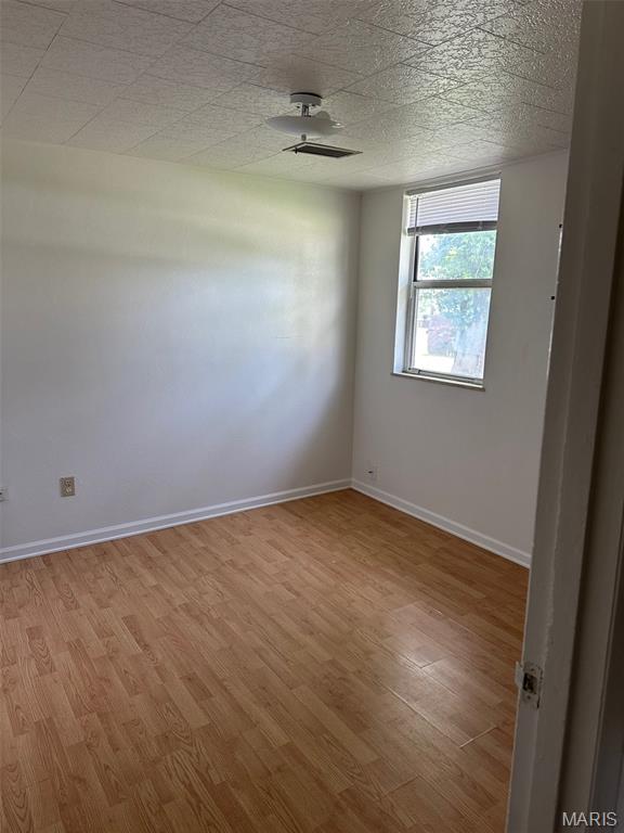 1707 Cross St, Ofallon, IL 62269 - unfurnished room featuring light wood-style flooring and baseboards