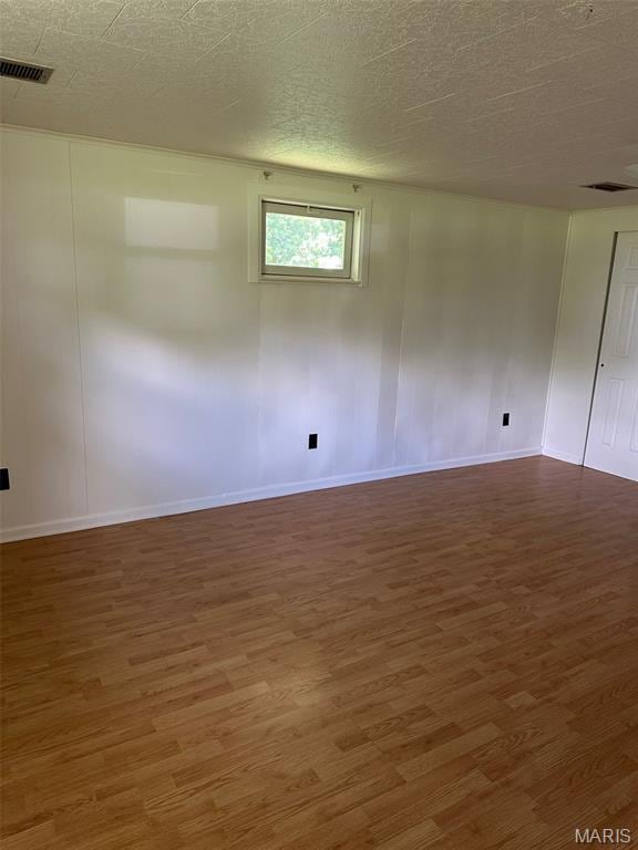 1707 Cross St, Ofallon, IL 62269 - empty room with wood finished floors and baseboards