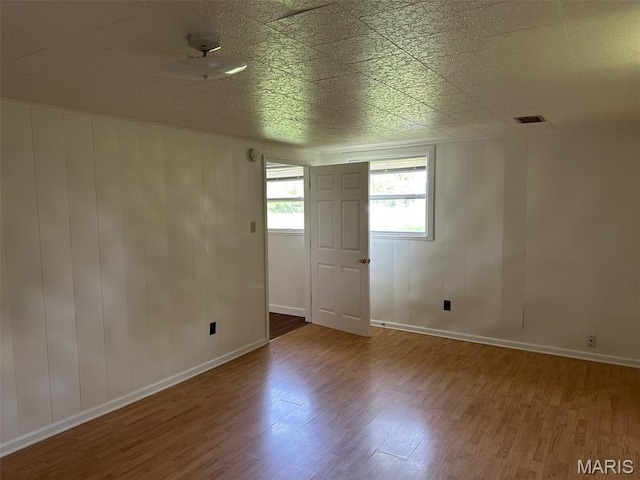 1707 Cross St, Ofallon, IL 62269 - unfurnished room with wood finished floors and baseboards