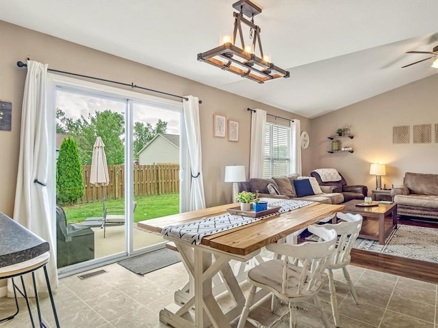 628 Hailie St, Saint Libory, IL 62282 - dining area with vaulted ceiling, tile patterned floors, and a ceiling fan