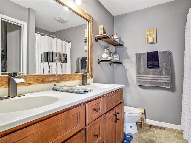 628 Hailie St, Saint Libory, IL 62282 - full bathroom with toilet, double vanity, tile patterned flooring, and baseboards