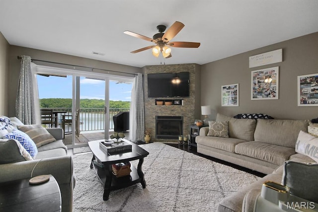 4800 Eagleview Dr Unit 113B, Osage Beach, MO 65065 - living room featuring ceiling fan, a fireplace, and wood finished floors