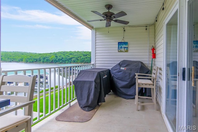4800 Eagleview Dr Unit 113B, Osage Beach, MO 65065 - balcony featuring grilling area, a ceiling fan, a wooded view, and a water view
