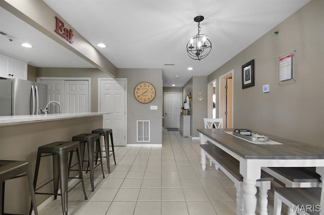 4800 Eagleview Dr Unit 113B, Osage Beach, MO 65065 - dining space with light tile patterned floors, baseboards, recessed lighting, and a chandelier