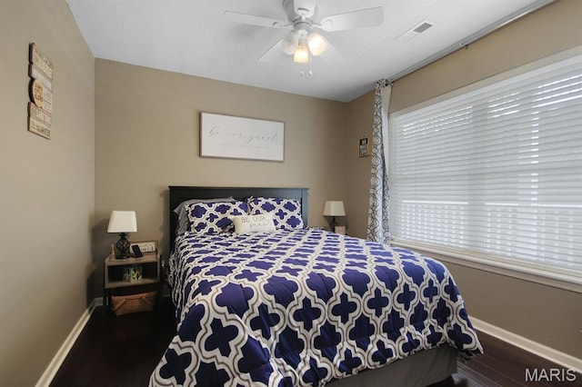 4800 Eagleview Dr Unit 113B, Osage Beach, MO 65065 - bedroom with baseboards, wood finished floors, and a ceiling fan