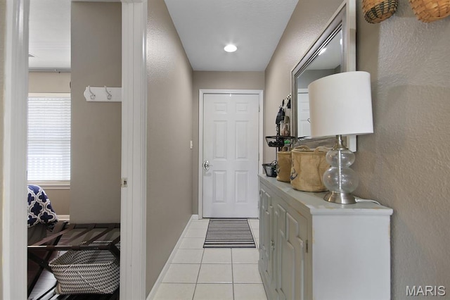 4800 Eagleview Dr Unit 113B, Osage Beach, MO 65065 - doorway to outside featuring light tile patterned floors and baseboards