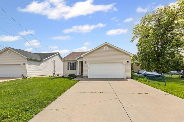 209 S Pence St, East Alton, IL 62024 - view of front of property featuring a front lawn, an attached garage, and driveway