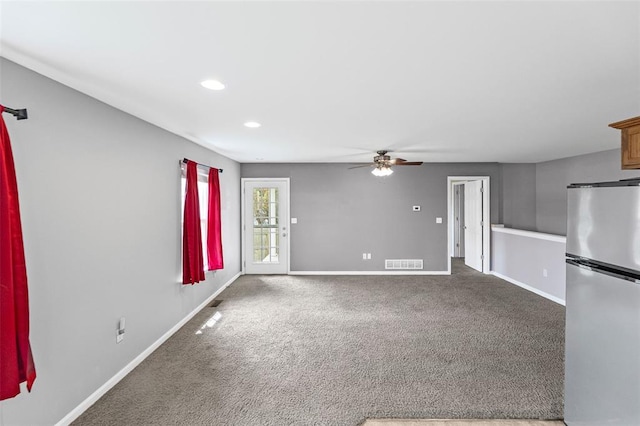 209 S Pence St, East Alton, IL 62024 - unfurnished living room with ceiling fan, baseboards, carpet, and recessed lighting