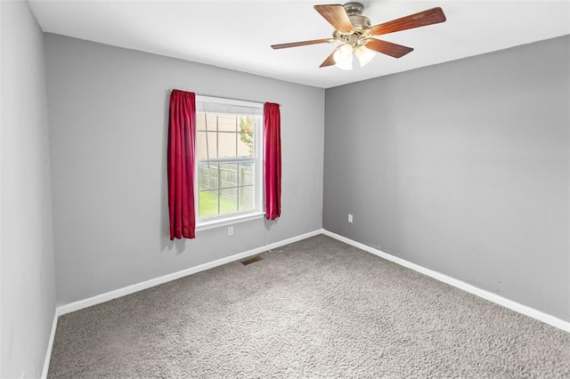 209 S Pence St, East Alton, IL 62024 - carpeted spare room featuring baseboards and a ceiling fan