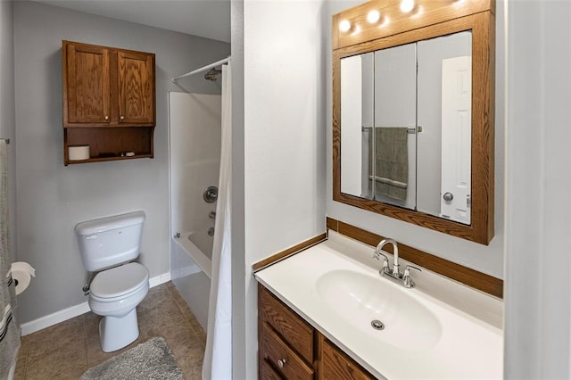 209 S Pence St, East Alton, IL 62024 - bathroom with toilet, vanity, shower / tub combination, tile patterned floors, and baseboards
