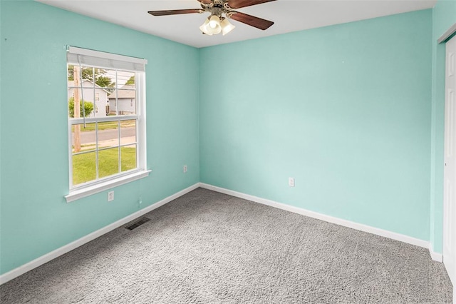 209 S Pence St, East Alton, IL 62024 - carpeted spare room with ceiling fan and baseboards