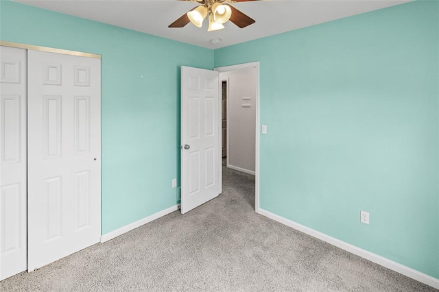 209 S Pence St, East Alton, IL 62024 - unfurnished bedroom with carpet floors, baseboards, a closet, and ceiling fan