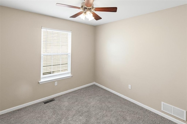 209 S Pence St, East Alton, IL 62024 - carpeted spare room featuring a ceiling fan, baseboards, and plenty of natural light
