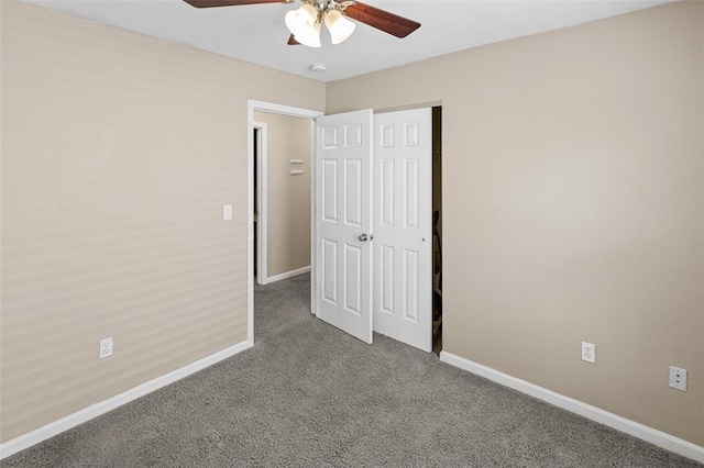 209 S Pence St, East Alton, IL 62024 - unfurnished bedroom with carpet, baseboards, a closet, and ceiling fan