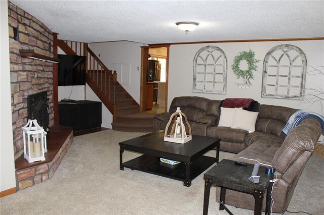 20143 State Highway 34, Piedmont, MO 63957 - living room featuring stairs, a textured ceiling, carpet, a fireplace, and crown molding