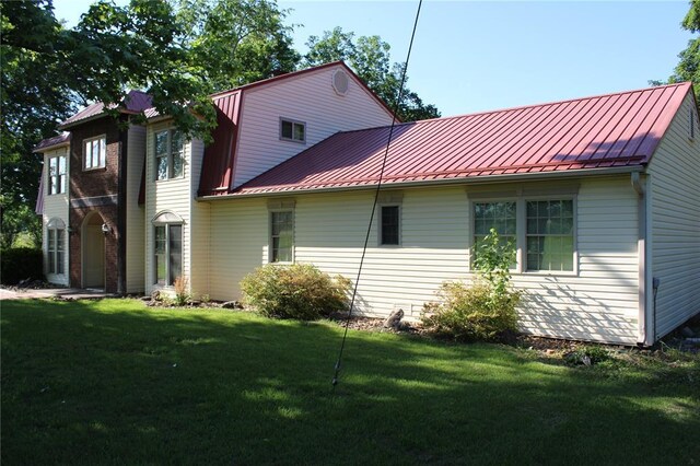 20143 State Highway 34, Piedmont, MO 63957 - view of home's exterior featuring a standing seam roof, metal roof, and a lawn