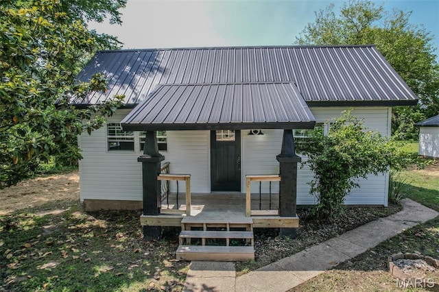 711 Noe Dr, Richland, MO 65556 - view of front facade featuring metal roof