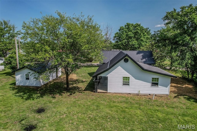 711 Noe Dr, Richland, MO 65556 - view of home's exterior featuring a yard and an outbuilding