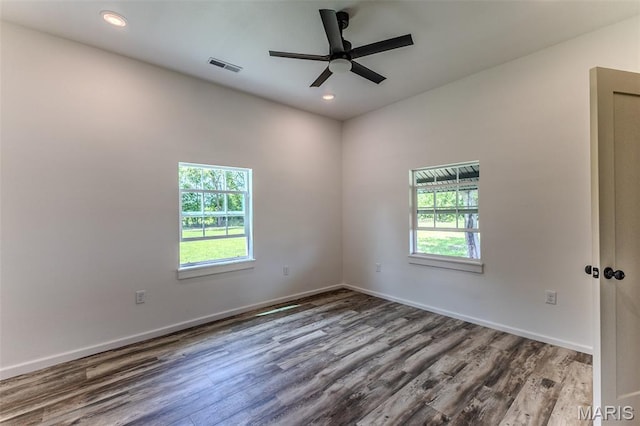 711 Noe Dr, Richland, MO 65556 - spare room with healthy amount of natural light, a ceiling fan, wood finished floors, baseboards, and recessed lighting