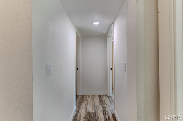 711 Noe Dr, Richland, MO 65556 - hallway featuring wood finished floors, baseboards, and recessed lighting