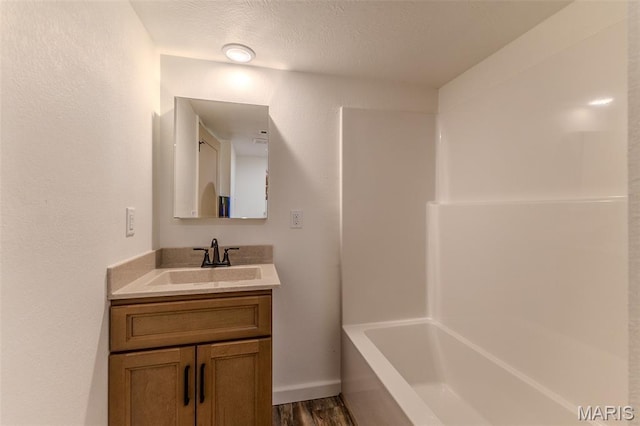 711 Noe Dr, Richland, MO 65556 - full bathroom with vanity, wood finished floors, and bathing tub / shower combination