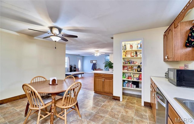 24925 Pike 244, Clarksville, MO 63336 - dining space with a ceiling fan, baseboards, and light stone finish floors