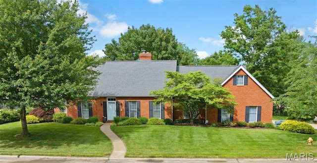 1 Lake Lorraine Dr, Swansea, IL 62226 - view of front facade with a front yard, brick siding, and a chimney