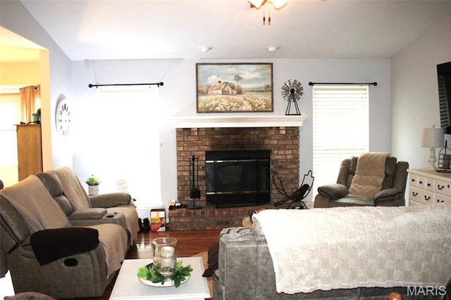 16 S Lang Dr, Ofallon, MO 63366 - living area with a brick fireplace and vaulted ceiling