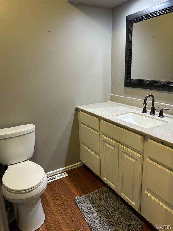16 S Lang Dr, Ofallon, MO 63366 - bathroom with vanity and wood finished floors