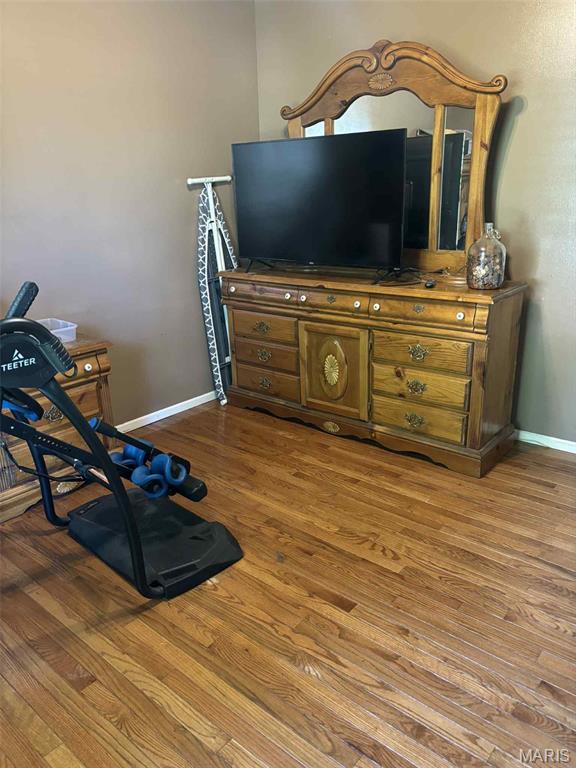 16 S Lang Dr, Ofallon, MO 63366 - sitting room with wood finished floors and baseboards