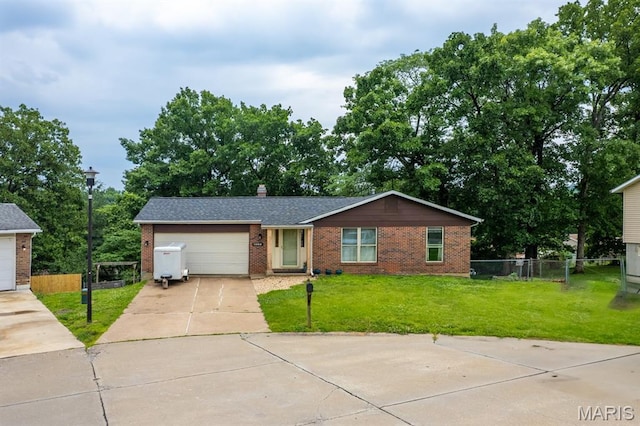 1956 Parkton W Dr, Barnhart, MO 63012 - view of front of property with brick siding, concrete driveway, a garage, and a chimney