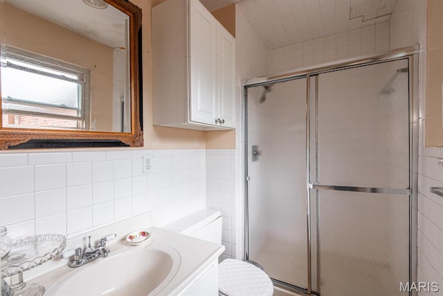 1956 Parkton W Dr, Barnhart, MO 63012 - bathroom with tile walls, a shower stall, and vanity